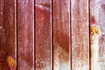 Red cracked worn boards. Wooden background.