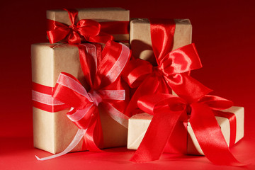 Gifts packed with craft paper and colorful satin ribbons	