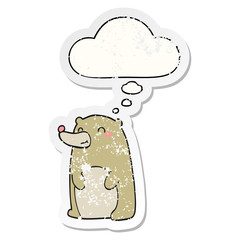 cute cartoon bear and thought bubble as a distressed worn sticker