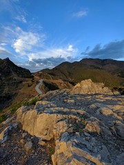 Rocks sunlight from clouds mountain