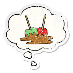 cartoon toffee apples and thought bubble as a distressed worn sticker