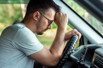 The man, the driver of the car fell asleep at the wheel during the trip. Emergency, accident,...