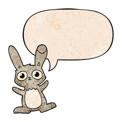 cute cartoon rabbit and speech bubble in retro texture style