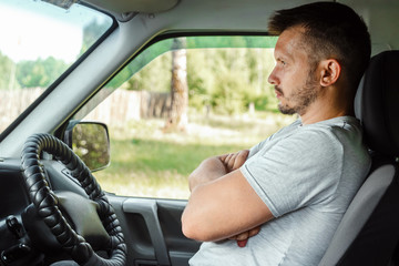 A man in an autonomous car. Self-driving. Concept autopilot, automotive engineering, artificial intelligence