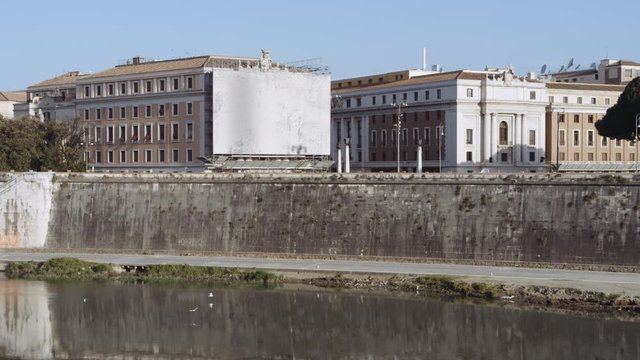 View of semi-abandoned Rome. Banks of Tiber river and just birds passing by. Shot near "Saint Angel Castle" Castel Sant Angelo. Shot on Red Monstro 8K. In 4K