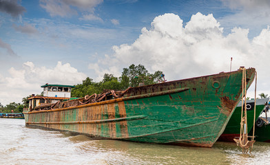 a rusty old ship at the Mekong Delta Vietnam