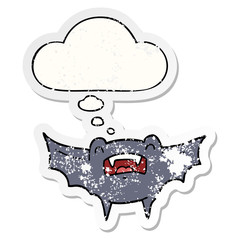 cartoon vampire bat and thought bubble as a distressed worn sticker