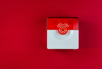 Fire safety system on a red background of a copy space
