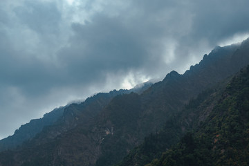 View of mountains covered by clouds