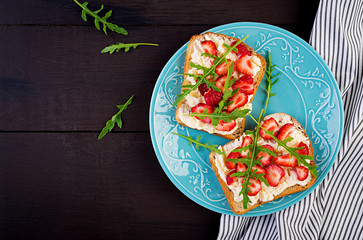 Healthy sandwich with strawberry and cream cheese. Top view