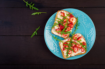 Healthy sandwich with strawberry and cream cheese. Top view