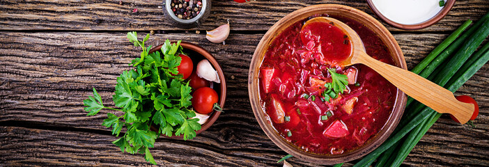 Traditional Ukrainian Russian borscht or red soup in the  bowl. Banner. Top view