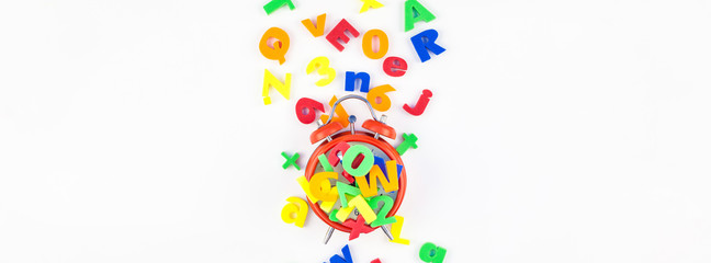 Alarm clock and multicolor alphabet