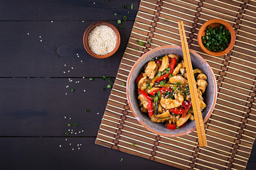 Stir fry chicken, zucchini, sweet peppers and green onion. Top view. Asian cuisine