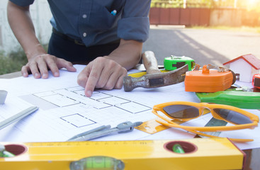 Architectural work site desk background construction project ideas concept, With drawing equipment.