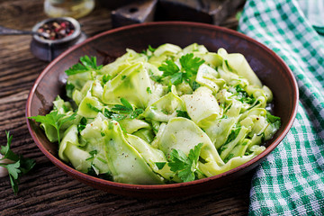 Salad of marinated zucchini in spices. Vegan food. Healthy meal.