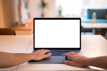 Laptop blank screen with hands on keyboard - POV using