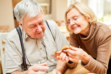 Senior couple is having fun with a patience game