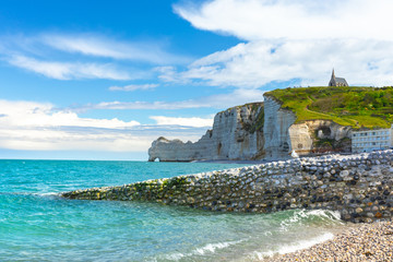 Picturesque panoramic landscape on the cliffs of Etretat. Natural amazing cliffs. Etretat, Normandy, France, La Manche or English Channel. Coast of the Pays de Caux area in sunny summer day. France
