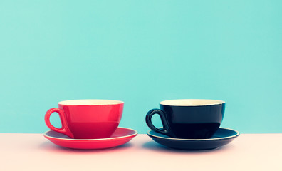 Two a cup of coffee on colorful pastel background