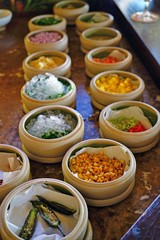 Mise en place of little dishes with ingredients for making tropical ceviche