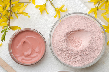 Cosmetic clay. Pink cosmetic clay in different types on a white wooden table. face mask and body....