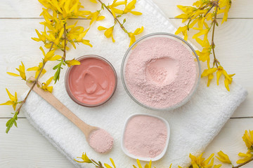 Cosmetic clay. Pink cosmetic clay in different types on a white wooden table. face mask and body....