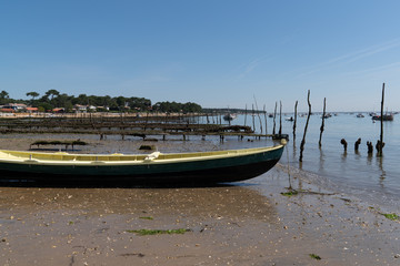 oyster farm boat in basin Arcachon bay in France at Canon beach