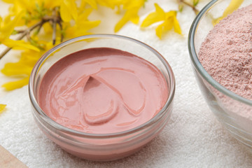 Cosmetic clay. Pink cosmetic clay in different types on a white wooden table. face mask and body. care products. spa.