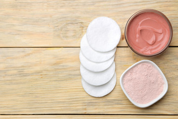 Cosmetic clay. Pink cosmetic clay in different types on a natural wooden table. face mask and body....