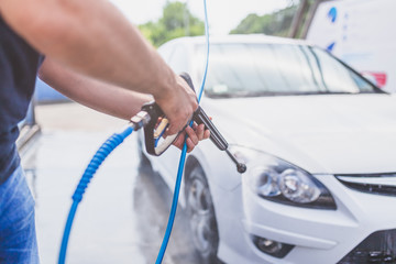 Self car washing by using high pressure water.