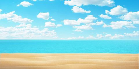 Fototapeta na wymiar Empty beach sand, sea and clue sky with clouds. Copy space fot promo text or logo.