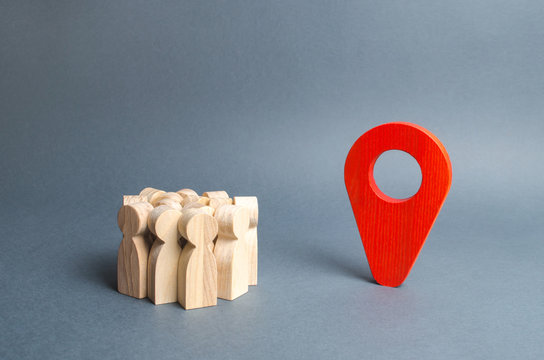 A crowd of people and a red pointer position. place to stay, travel and tourism. meeting place, evacuation point. The goal is to reach your destination. Mass transport system and infrastructure