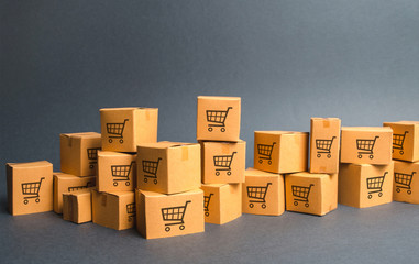 Many cardboard boxeswith drawing of shopping carts. products, goods, Warehouse, stock. commerce and...
