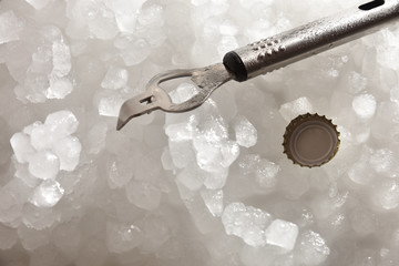 Bottle opener and cap on crushed ice