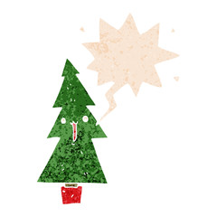 cartoon christmas tree and speech bubble in retro textured style