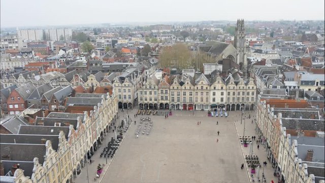 Time lapse from the main square of Arras, a city located in the north of France. People are moving. Filmed from the belfry next to City Hall.  Cloudy weather.