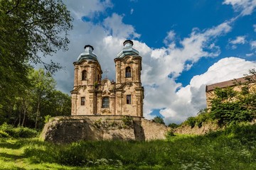 Obraz premium Skoky, Zlutice / Czech Republic - June 21 2019: Baroque church of the Virgin Mary Visitation in Skoky, Maria Stock, is a former pilgrimage place in West Bohemia. Sunny day, blue sky with clouds.