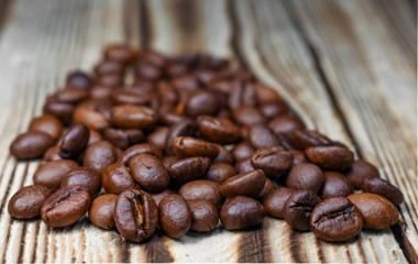 Ground coffee, espresso on a wooden board background