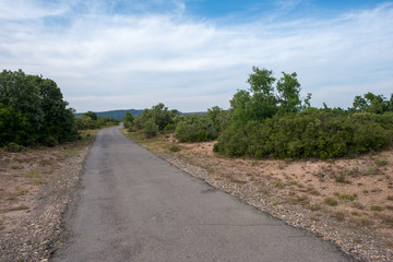 Rural road between mountains of the Sierra de Gudar, Valbona