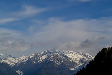 green meadow glacier and snow mountains