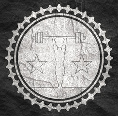 bodybuilder and barbell silhouettes. Icon of the posing athlete. Sporty style stamp