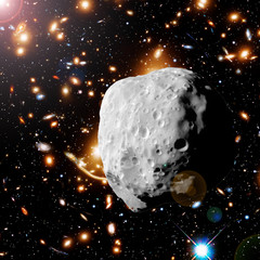 Asteroid flying in the deep space. Elements of this image furnished by NASA.