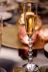glass of champaign on festive table