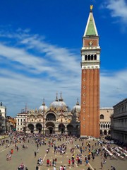 Whole St Mark square pith the campanile and the Cathedral and crowds of people in Venice
