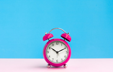 Close up colorful alarm clock on pastel background.timing concepts