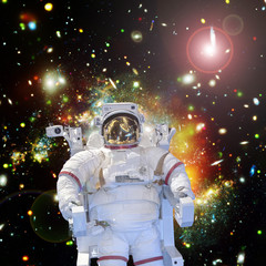 Astronaut and space, galaxies and stars. The elements of this image furnished by NASA.