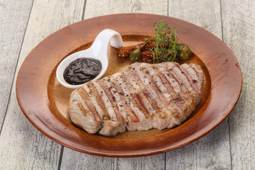 Grilled pork steak with pepper sauce