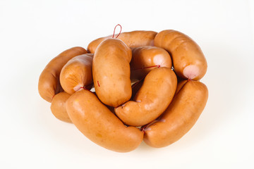 Tasty meat sausages over white background