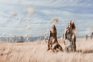 girls in the dry field on a sunset